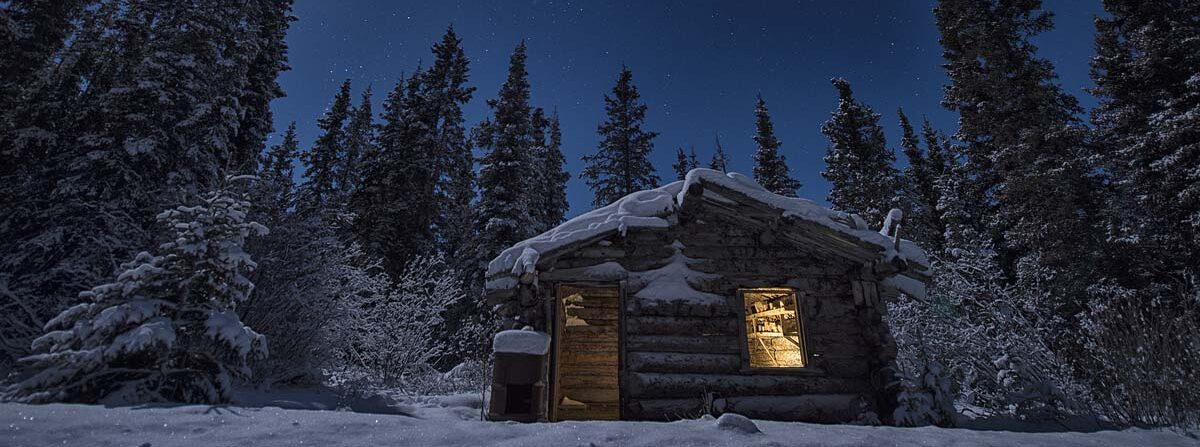Cabin Image of Cabin in snowy winter setting at night